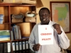 A South Sudanese man holds a sign stating 